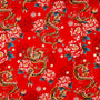 Polyester silk fabric with golden dragons and large pink chrysanthemums with teal leaves used for creating Vietnamese hand made lanterns in Hoi An.
