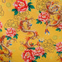 Polyester silk fabric with dragons and flowers on a yellow background