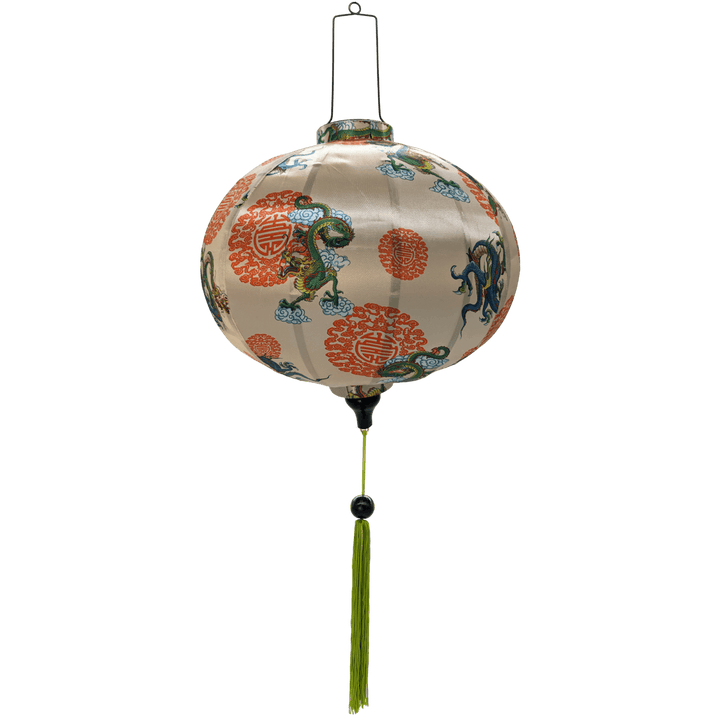 Round Hoi An Vietnamese Lantern with green tassel and print of green and blue dragons on a rich creamy backdrop.