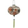 Round Hoi An Vietnamese Lantern with green tassel and print of green and blue dragons on a rich creamy backdrop.