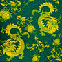 A close up of polyester and silk fabric with a print of golden yellow dragons and flowers with light green sea swirls on a dark rich green background.