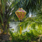 Diamond shaped lantern with a river and palm tree in the background featuring a print of golden dragons and large pink chrysanthemums on yellow background.