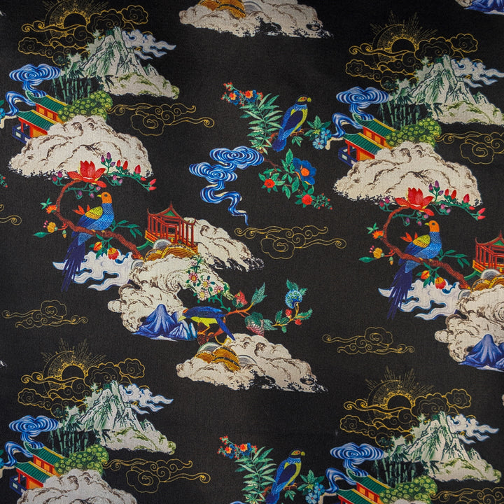 Polyester silk fabric with intricate patterns of mountains, clouds, and traditional elements on a black background.
