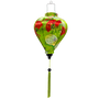Balloon shaped Vietnamese silk lantern handmade in Hoi An with green background adorned with red folding fans decorated with delicate plum blossoms. 