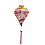 Vibrant balloon shaped lantern with red tassel, intricate floral, fan, and lantern designs, handcrafted in Hoi An for elegant lighting.

