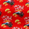Polyester silk fabric with a design of yellow fans, a house overlooking trees beneath snow capped mountains and surrounded by blooms of pink on a brilliant red background. 