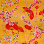 Decorative fabric pattern with red fans, pink flowers, and bamboo on a yellow background