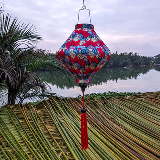 Lozenge shaped Hoi An lantern with feather patterns and paisley accents, perfect for home, patio, or event decor.
