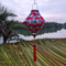 Lozenge shaped Hoi An lantern with feather patterns and paisley accents, perfect for home, patio, or event decor.
