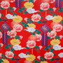 Traditional pattern with flowers, lanterns, and clouds on a red background.