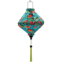 Lozenge shaped Vietnamese lantern with green tassel.