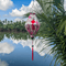 Tube shaped Vietnamese lantern hanging in front of the Thu Bon River in Hoi An.