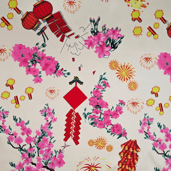 Polyester silk fabric with firecrackers, lanterns and pink blossoms, used to create Vietnamese handmade lanterns.