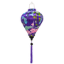 Balloon shaped lantern with a print of koi fish swimming around bamboo reeds and pink lotus flowers on purple background.