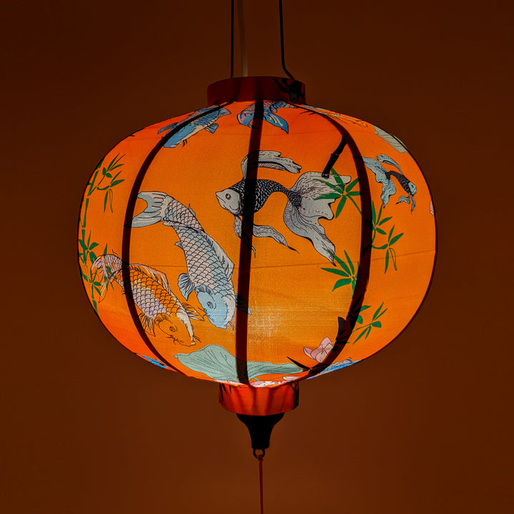 Glowing Round Vietnamese lantern with orange hue.