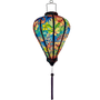 Glowing Vietnamese silk lantern with pink flamingos and flowers.