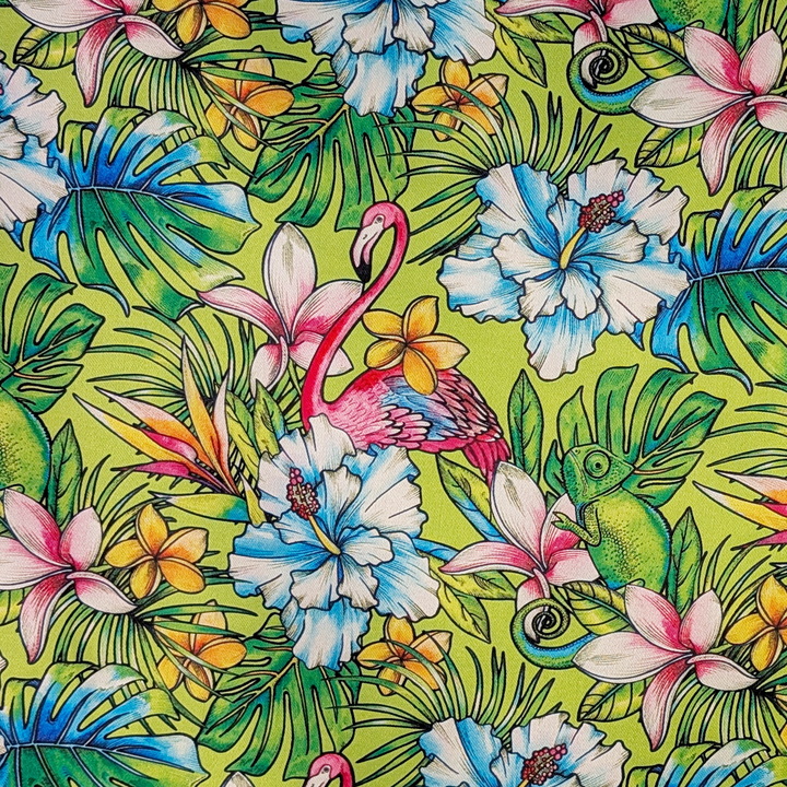 Tropical fabric pattern with flamingos, flowers, and leaves on a green background