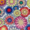 Polyester silk fabric with an illustration of floating flowers in various soft pastel colours on a white background.