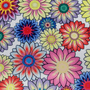 Polyester silk fabric with an illustration of floating flowers in various soft pastel colours on a white background.
