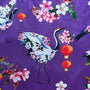 Polyester silk fabric with large cranes and round lanterns, surrounded by pink and white flowers on a purple background.