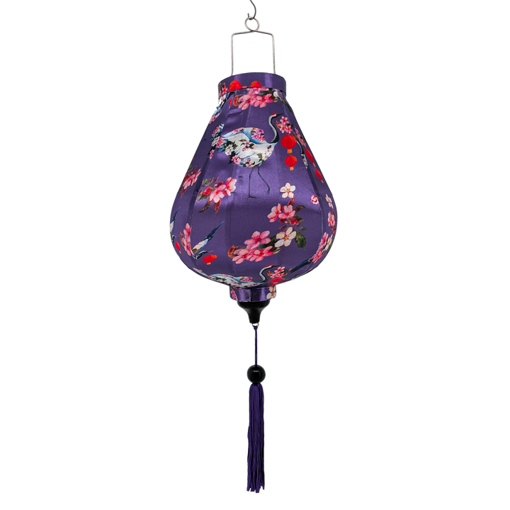 Garlic shaped lantern with purple tassel and flower cranes on a purple background
