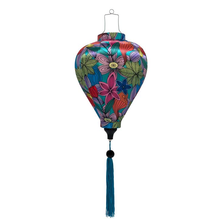 Balloon shaped lantern with blue tassel made with steel, bamboo and fabric with a vibrant and modern floral design on a blue background. 