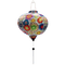Round shape lantern with white tassel and an illustration of flowers on white background.