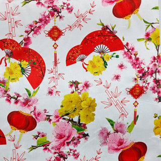 Polyester silk fabric featuring floral patterns, traditional fans, and lantern motifs used to create the Hoi An Lanterns.

