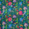 Close up of polyester silk fabric featuring a print of lush, tropical flowers and birds on a deep green silk fabric. 