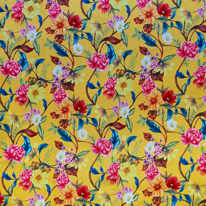 Polyester silk fabric featuring a colourful floral pattern on a yellow background
