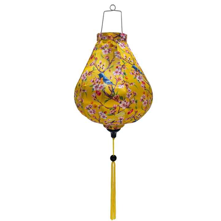 Garlic shape Vietnamese silk lantern with vibrant and colourful print of yellow and bright blue and orange flycatcher birds sitting in a cherry tree. 