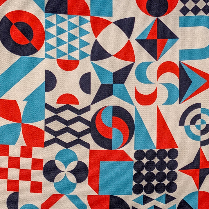 Geometric pattern with red, light blue, and dark blue shapes on a white background