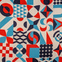 Geometric pattern with red, light blue, and dark blue shapes on a white background