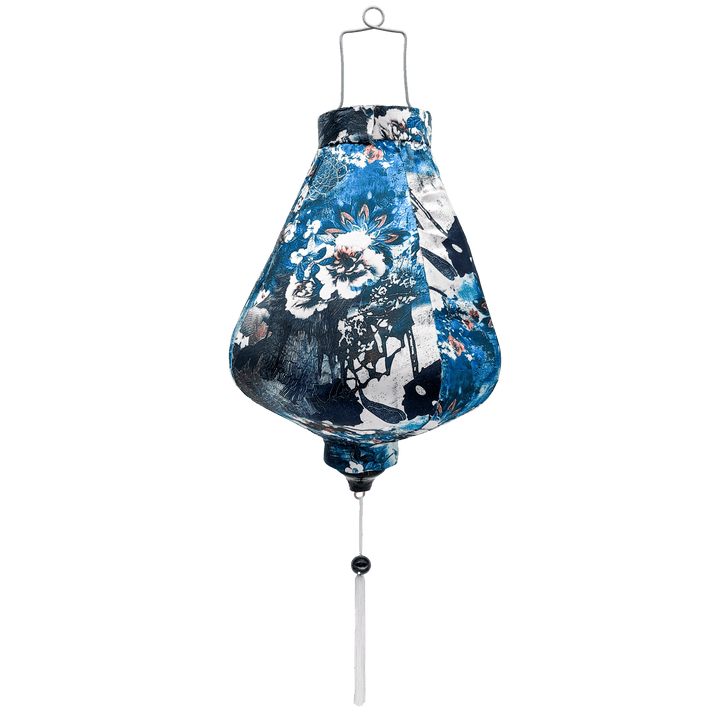 Teardrop shape Vietnamese lantern with white tassel and silk fabric with a print of geometric shaped flowers in muted blue colours.