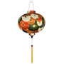 Round shaped lantern with flowers with gold outline in colours orange, white, green, and dark blue.