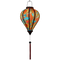 Glowing Balloon shaped Vietnamese lantern with red, blue, orange, green and yellow paisley print.