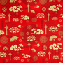 Polyester silk fabric with intricate golden clouds, delicate lotus flowers, elegant fans and symbols against red backdrop.