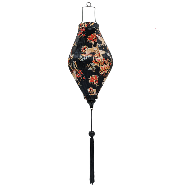 Tube shaped Vietnamese Hoi An Lantern featuring golden cranes amongst red and gold lined flowers with subtle grey shimmer of a geometric pattern against black, perfect for home decoration.