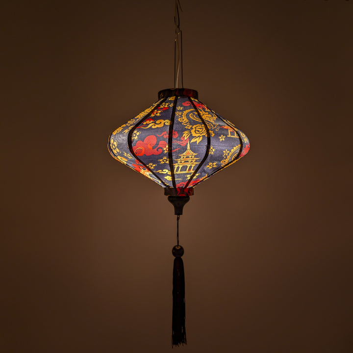 Glowing lantern with golden dragon and red clouds on a black background.