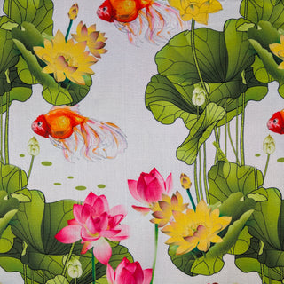 Fabric with a pattern of goldfish, lotus flowers, and leaves on a white background.
