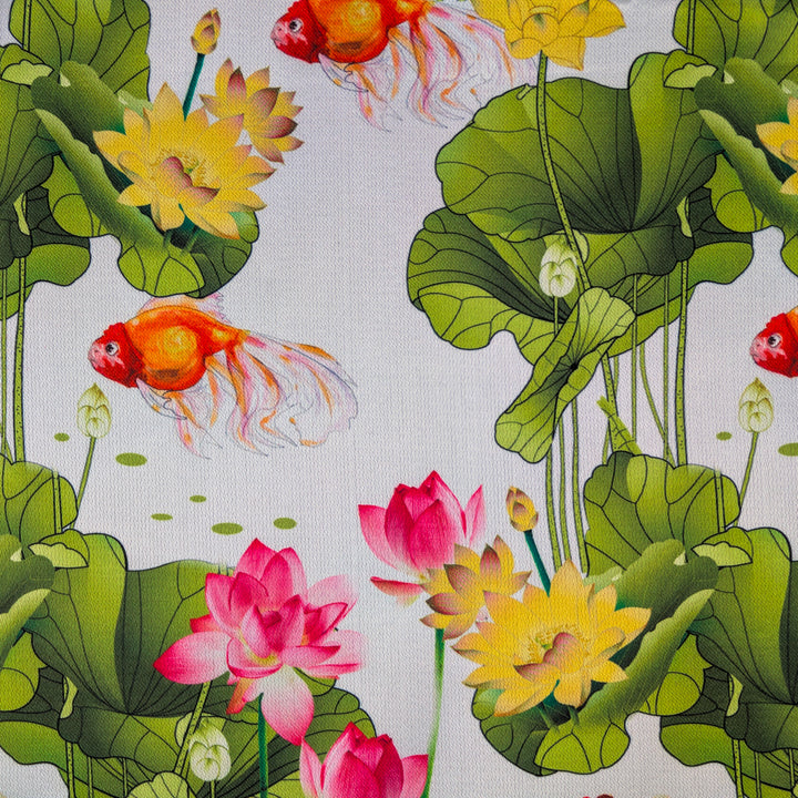 Fabric with a pattern of goldfish, lotus flowers, and leaves on a white background.