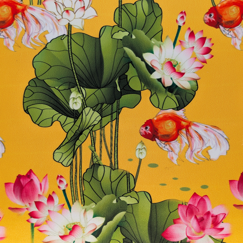 Polyester silk fabric featuring gold fish and lotus flowers on a yellow background.