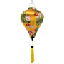 Hanging lantern with gold fish and lotus flowers on a yellow background with yellow tassel.