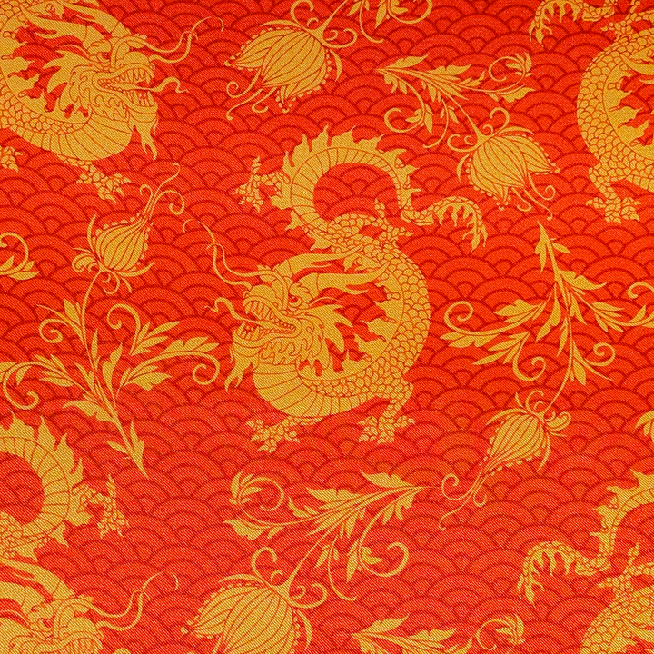 Orange fabric with gold dragon and floral patterns