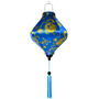 Decorative Vietnamese silk lantern with golden yellow dragon design on a blue background