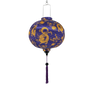 Handmade round Vietnamese silk lantern with purple tassel, golden dragons design on a purple background