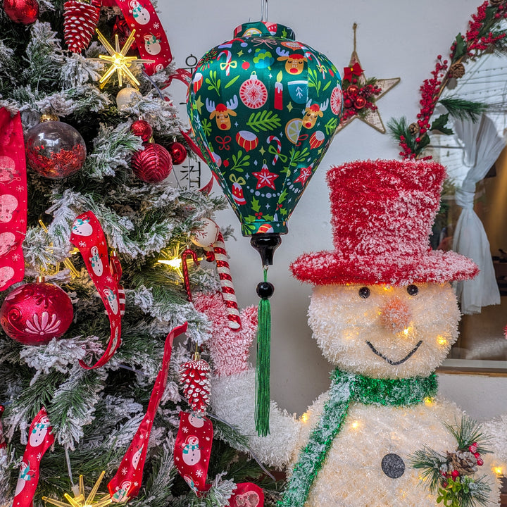Balloon shape Vietnamese silk lantern with Christmas print. The perfect decoration for the holiday season.