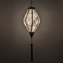 Glowing Tube shaped lantern with print of temples and bamboo in greyscale colours with grey tassel