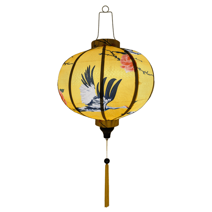 Glowing round shaped lantern with yellow tassel.