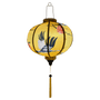 Glowing round shaped lantern with yellow tassel.